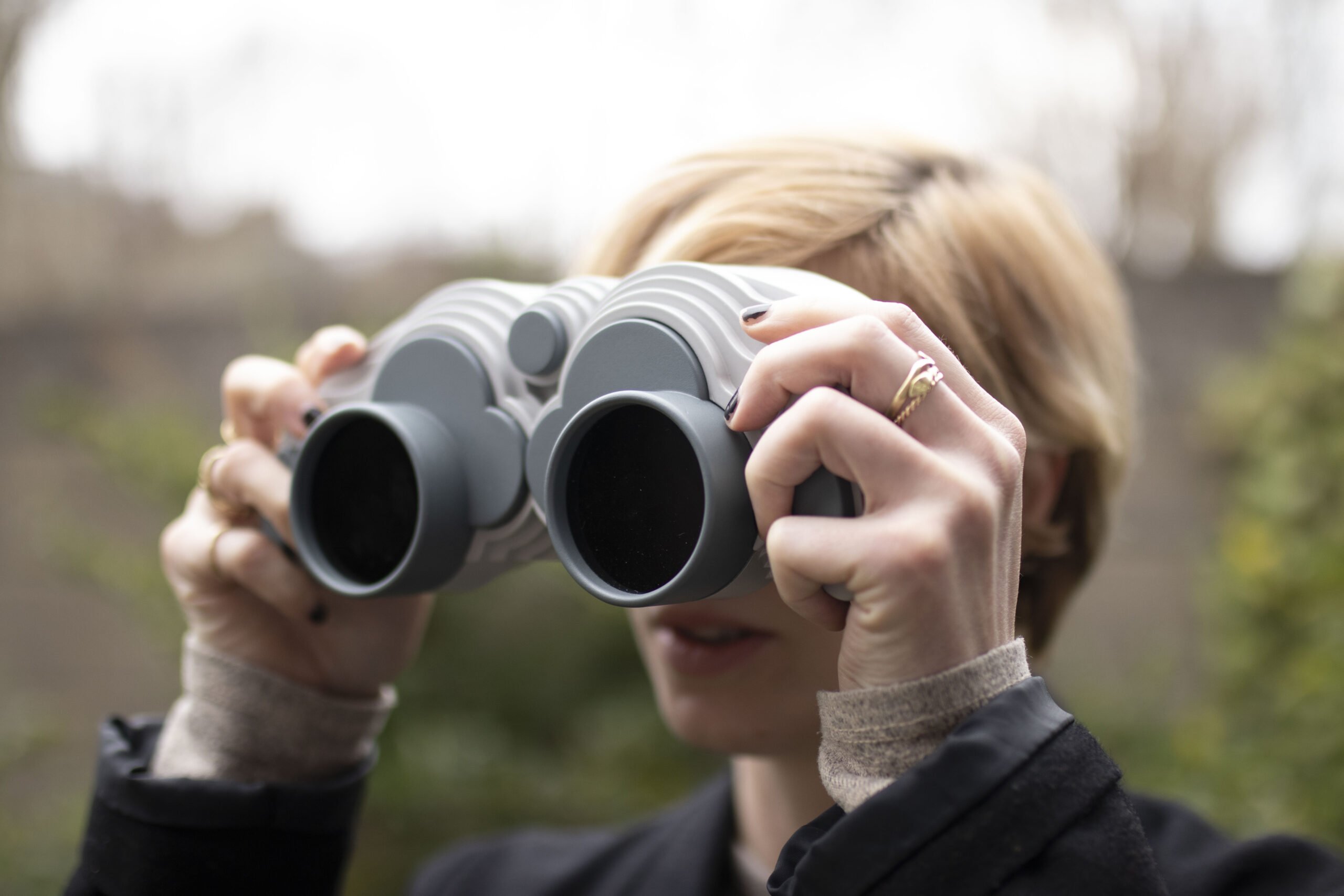 Person looking through handheld VR binoculars