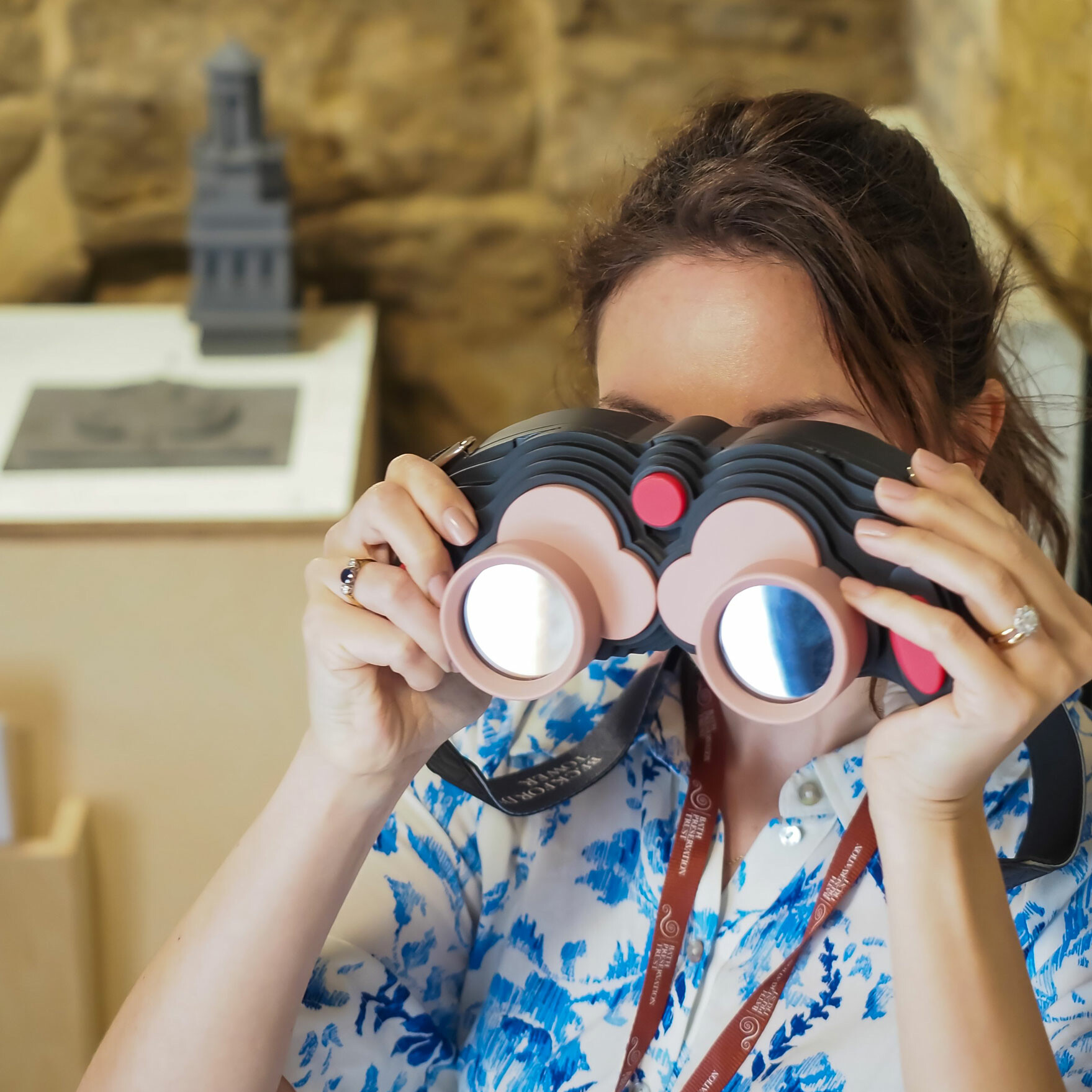 Bath AR Trail, Beckford's Tower Woman looking through AR binoculars, AR tower viewer, VR tower viewer